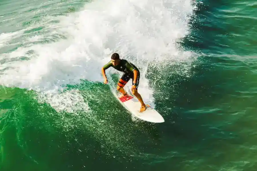 Houston outdoor activities: man on surfboard surfing against waves